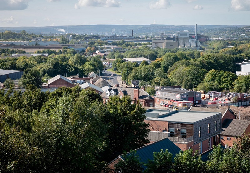 An elevated landscape view over this northern town, showing the urban industrial townscape including Templeborough Biomass Power Plant and steel mills